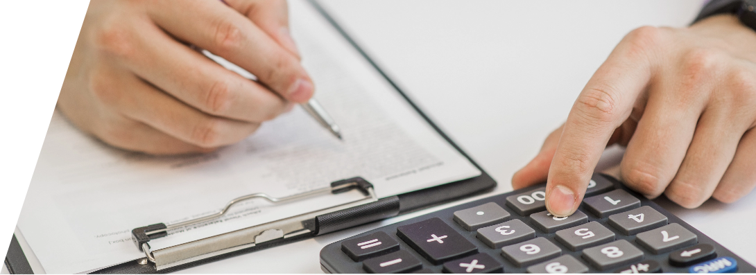 close-up-businessman-calculating-invoices-using-calculator